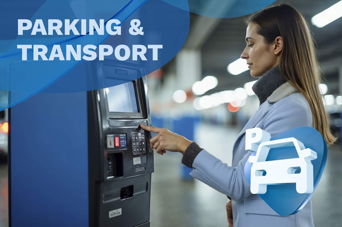 Image of someone paying for a parking ticket at a kiosk.